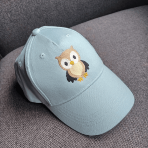 pet met uiltje geborduurd